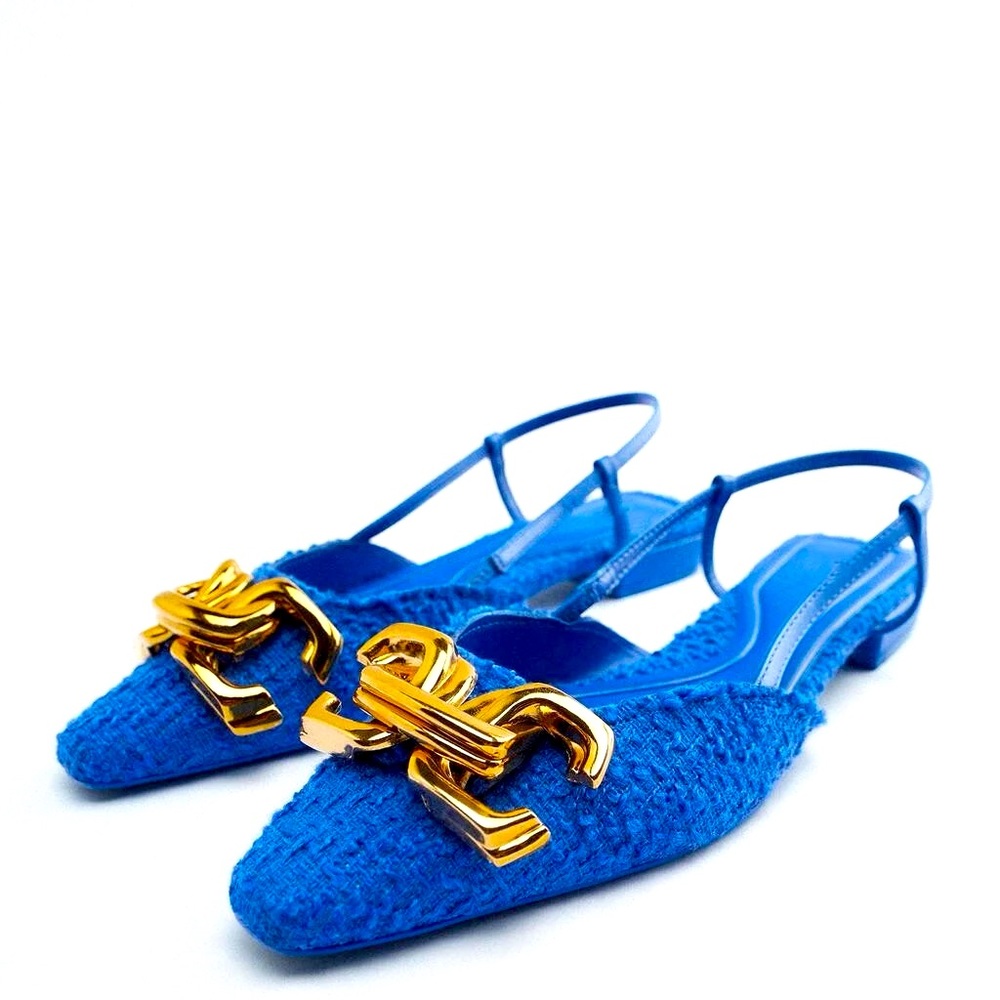 Flat sling back sandal knit upper w/gold accent hardware.